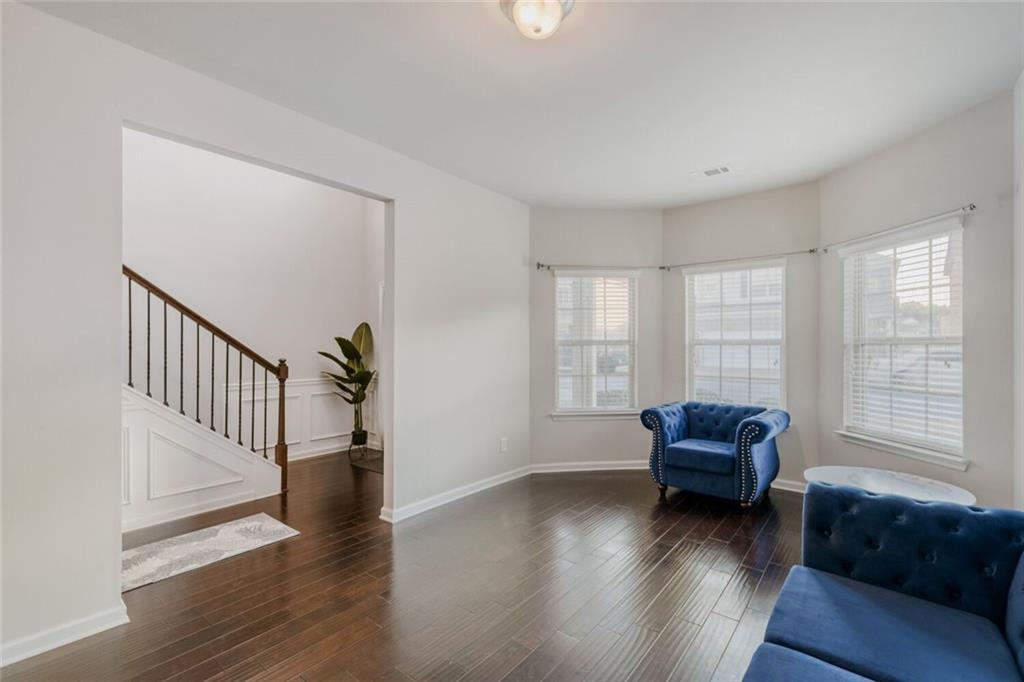7607 Crawford Court Fairburn, GA 30213 - Photo 14 of 32 a living room with furniture and a window