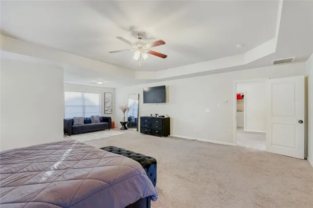 a bed room with a bed and a television