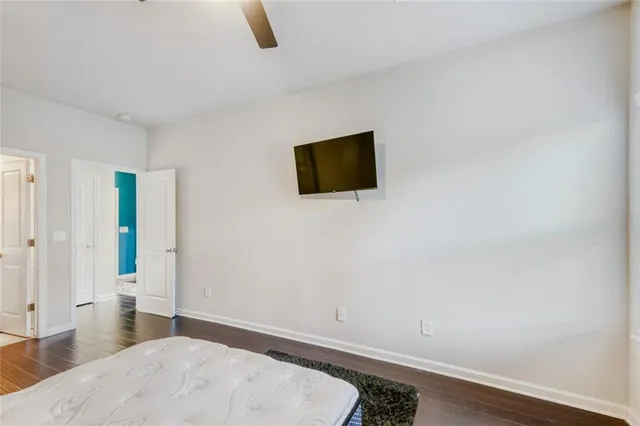 a room with a bed and a flat screen tv