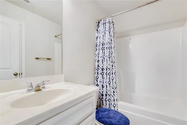 a bathroom with a sink a toilet and a bathtub