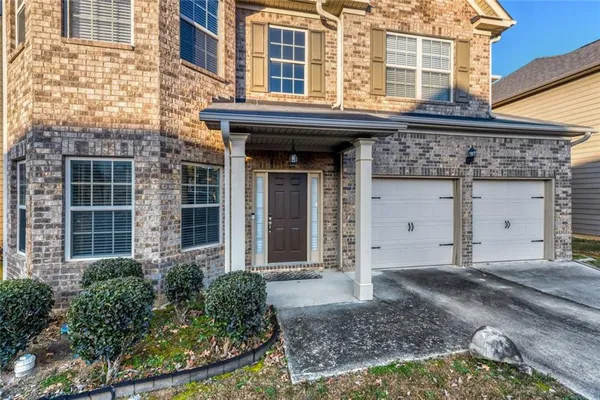 a view of a brick building with many windows