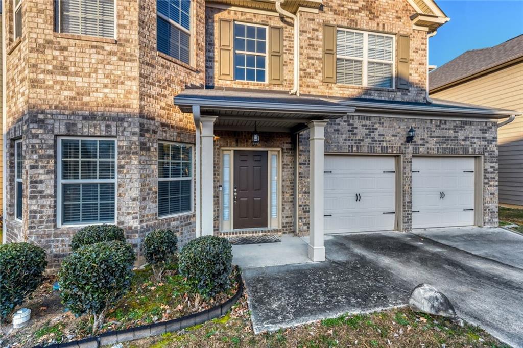7607 Crawford Court Fairburn, GA 30213 - Photo 31 of 32 a view of a brick building with many windows