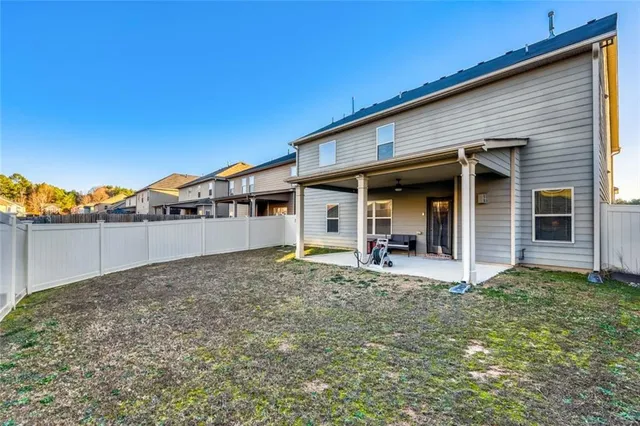 a view of a house with wooden floor and a yard