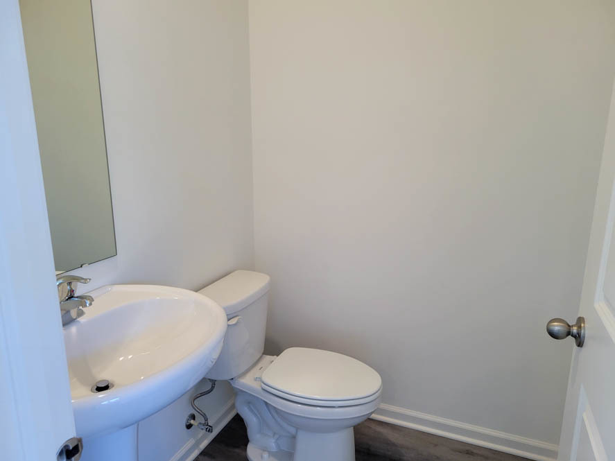 335 Summit Circle Lombard, IL 60148 - Photo 4 of 48 a white toilet sitting next to a bathroom sink
