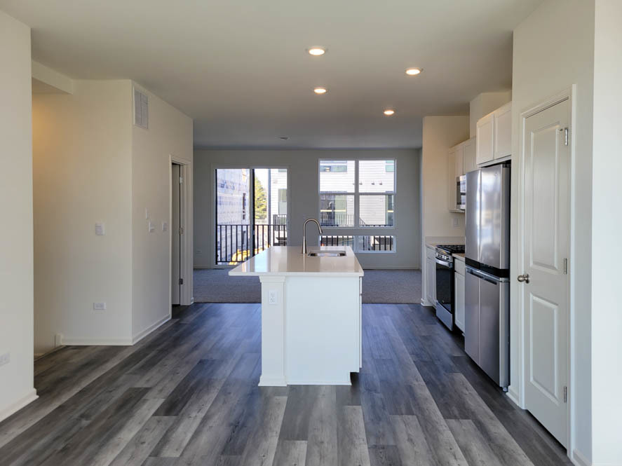 335 Summit Circle Lombard, IL 60148 - Photo 6 of 48 a kitchen with a refrigerator and wooden floor