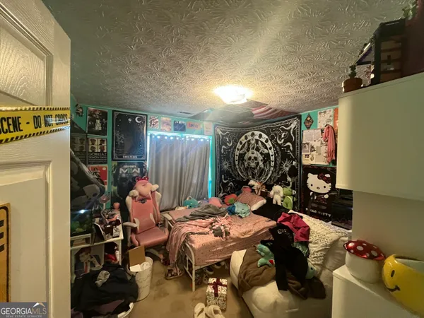 a bed room with a bed and a window