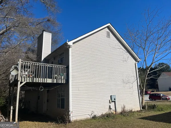 a view of a house with a deck