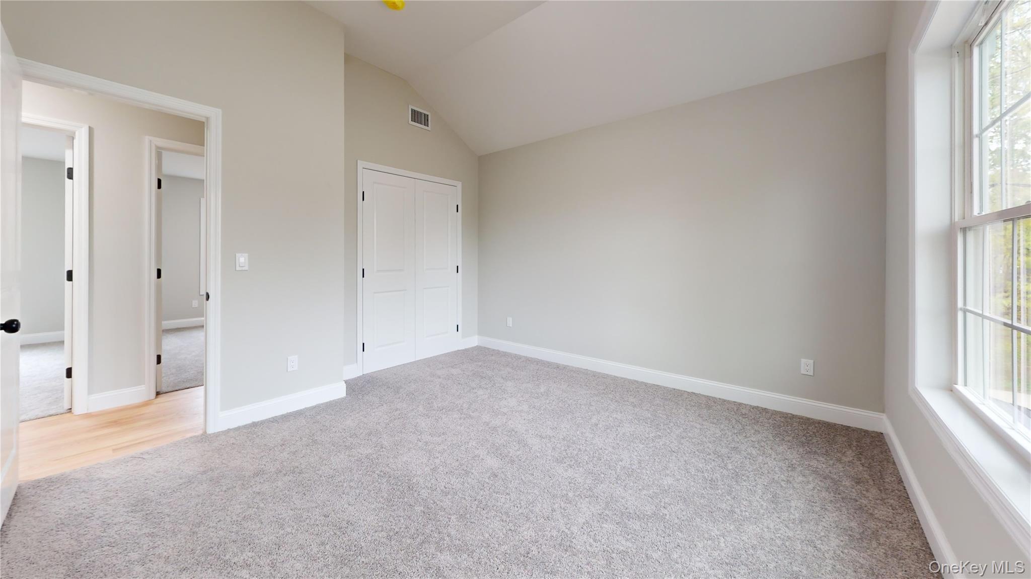 492 Blue Point Road Farmingville, NY 11738 - Photo 10 of 21 an empty room with windows and entrance