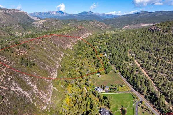a view of a yard with a mountain