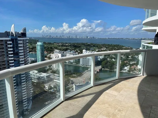 a view of a balcony with city view