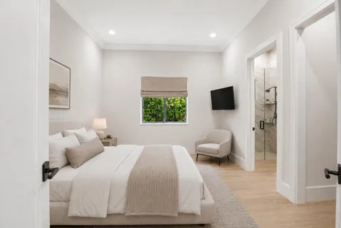 a bedroom with a bed and a couch