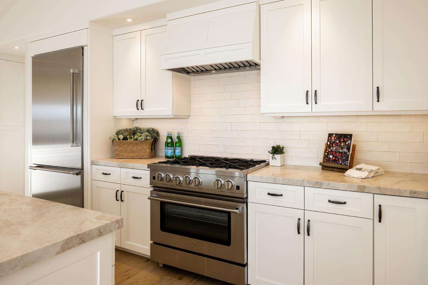 2744 Pradera Road Carmel, CA 93923 - Photo 8 of 34 a kitchen with cabinets stainless steel appliances and wooden floor