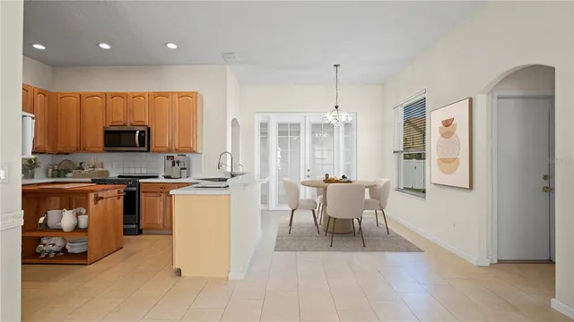 a kitchen with a sink appliances and cabinets