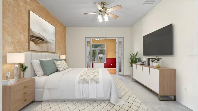 a bedroom with a bed and a flat screen tv