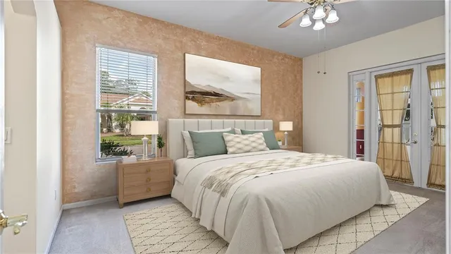 a bedroom with a large bed and a window