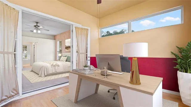 a living room with furniture and a potted plant