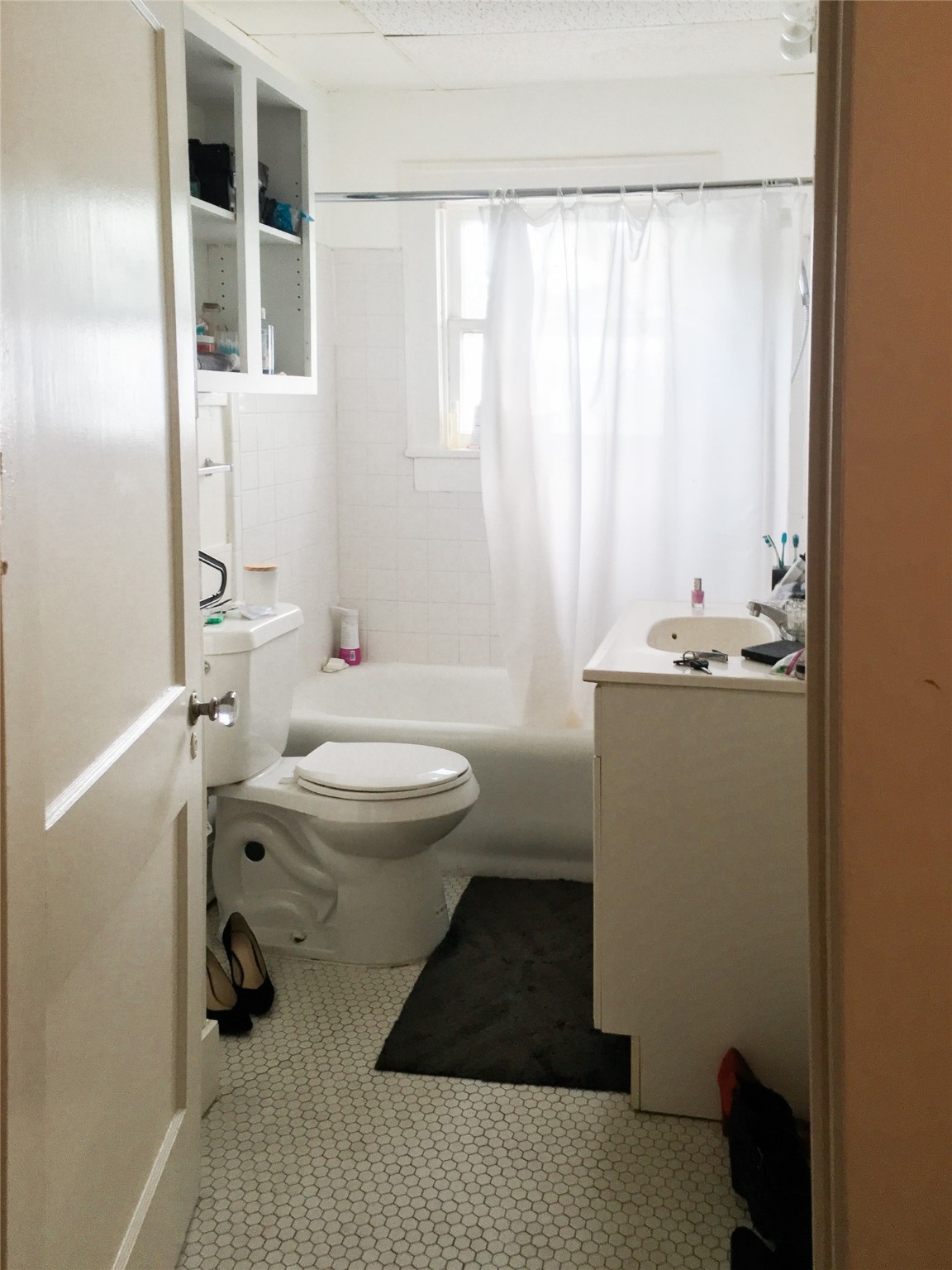 1539 Westheimer Road Houston, TX 77006 - Photo 10 of 10 a bathroom with a sink toilet and window