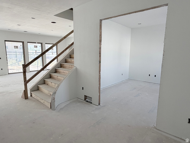 208 East 400 South Mapleton, UT 84664 - Photo 11 of 20 Curved staircase with wood railing, recessed lighting, and expansive windows