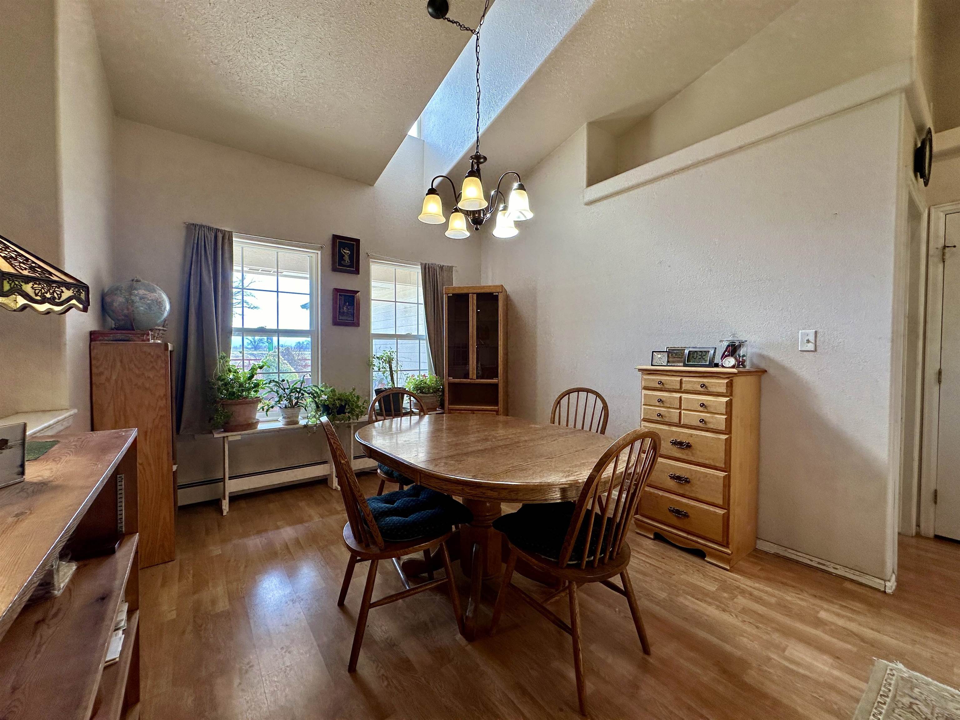 881 22 Road Grand Junction, CO 81505 - Photo 7 of 36 a view of a dining room with furniture window and wooden floor