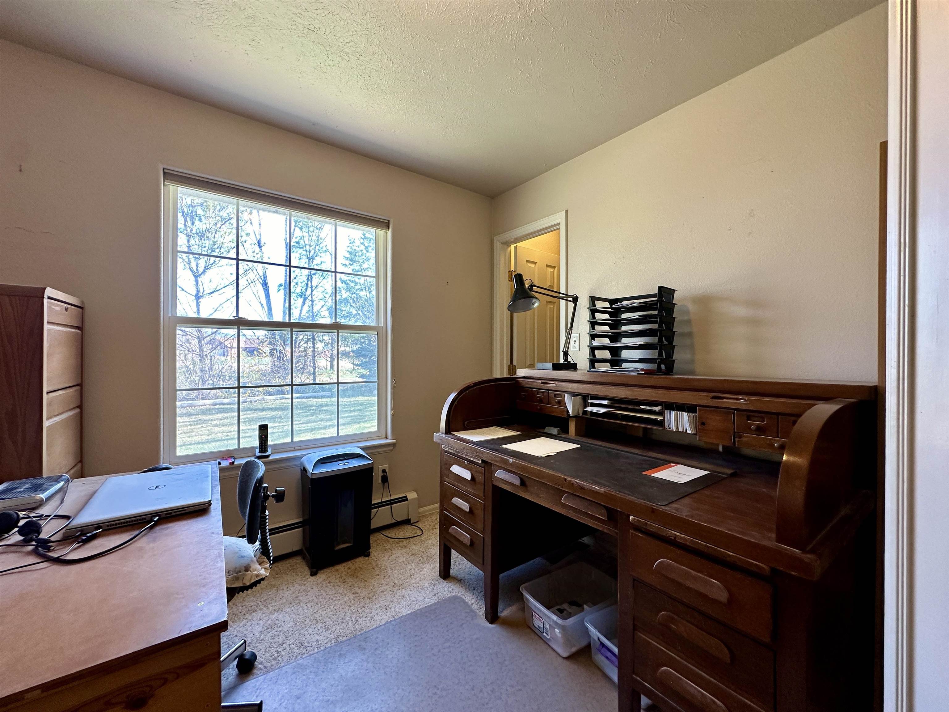 881 22 Road Grand Junction, CO 81505 - Photo 8 of 36 a view of a workspace with furniture and a window