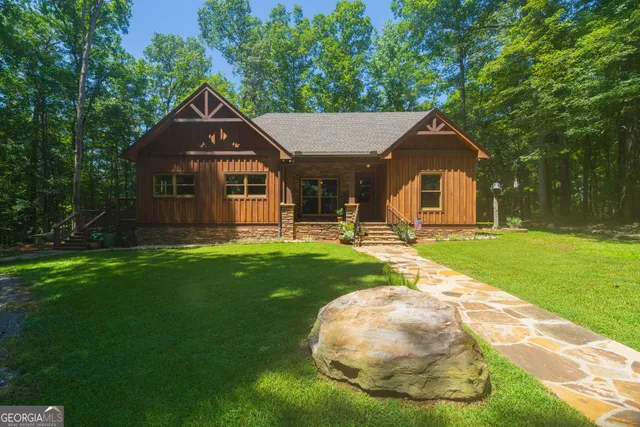 a front view of a house with garden