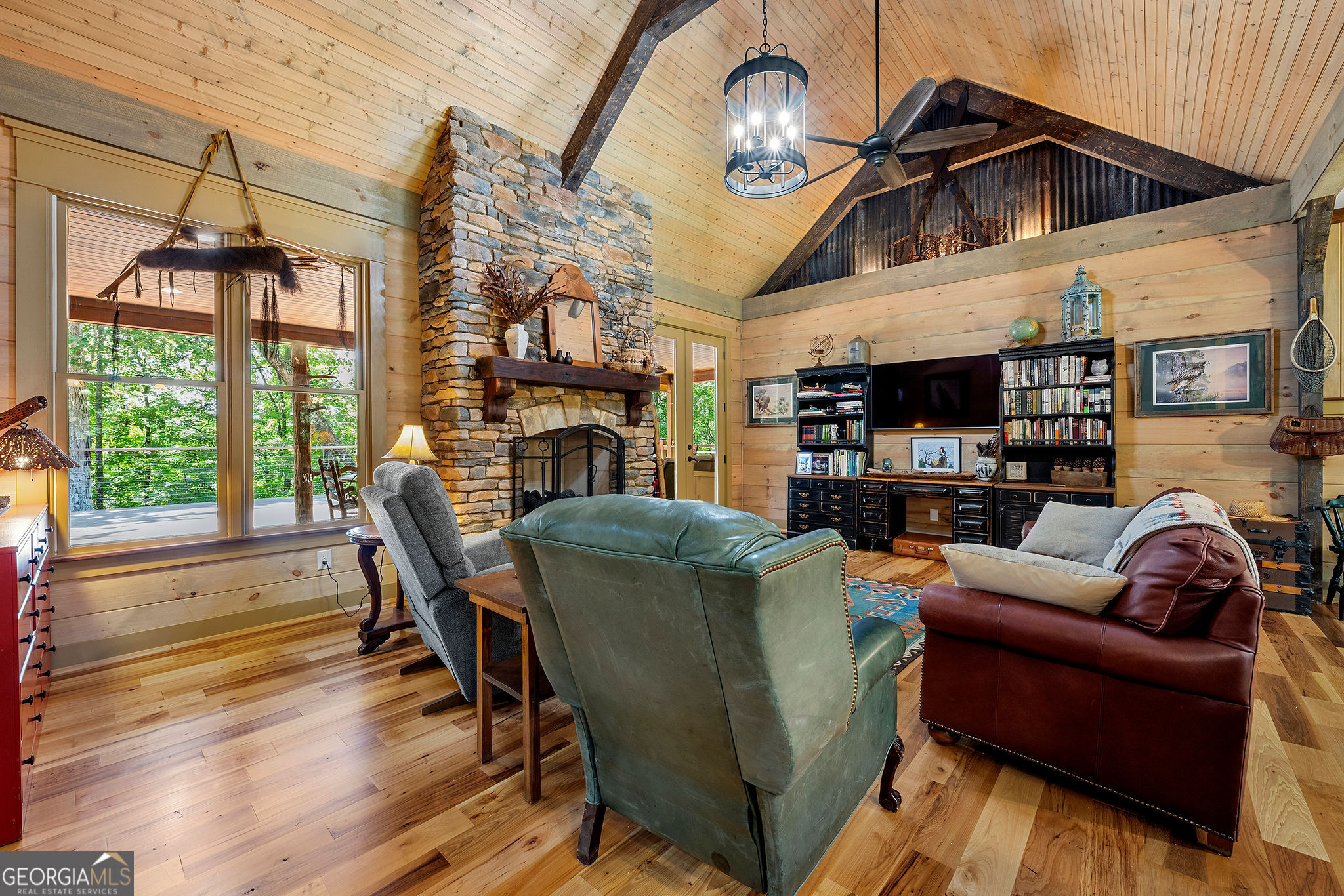 1638 Minor Road Culloden, GA 31016 - Photo 11 of 144 a living room with furniture a fireplace and a floor to ceiling window