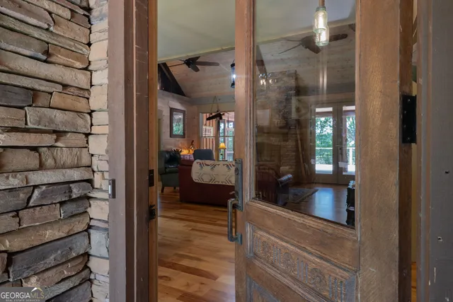 a bedroom with a bed dresser and a flat tv screen
