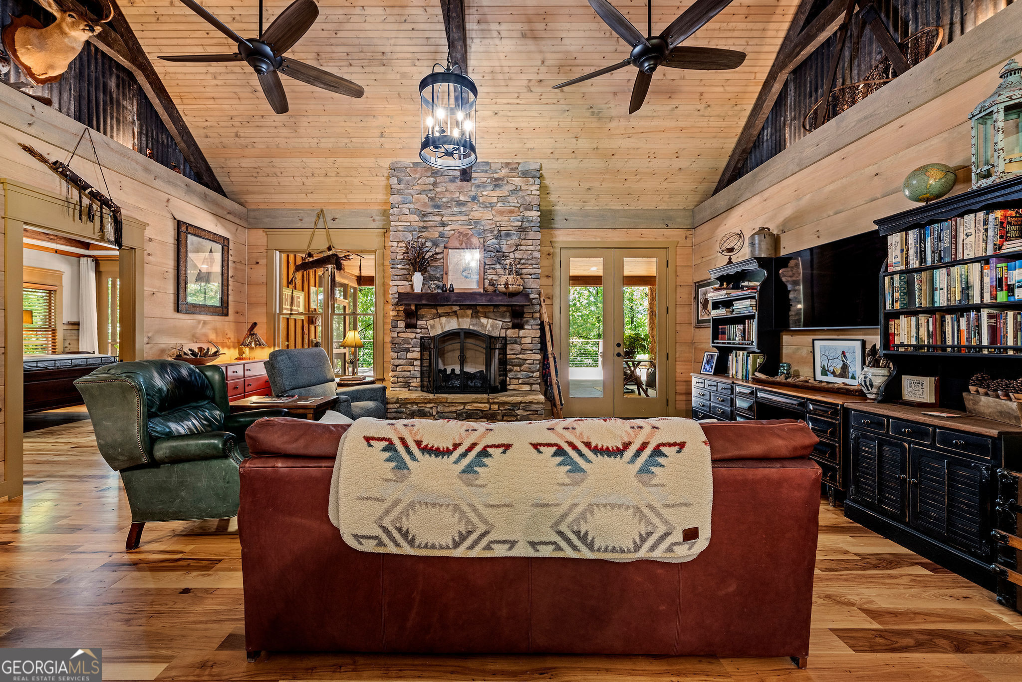 1638 Minor Road Culloden, GA 31016 - Photo 26 of 144 a living room with furniture a fireplace and a flat screen tv