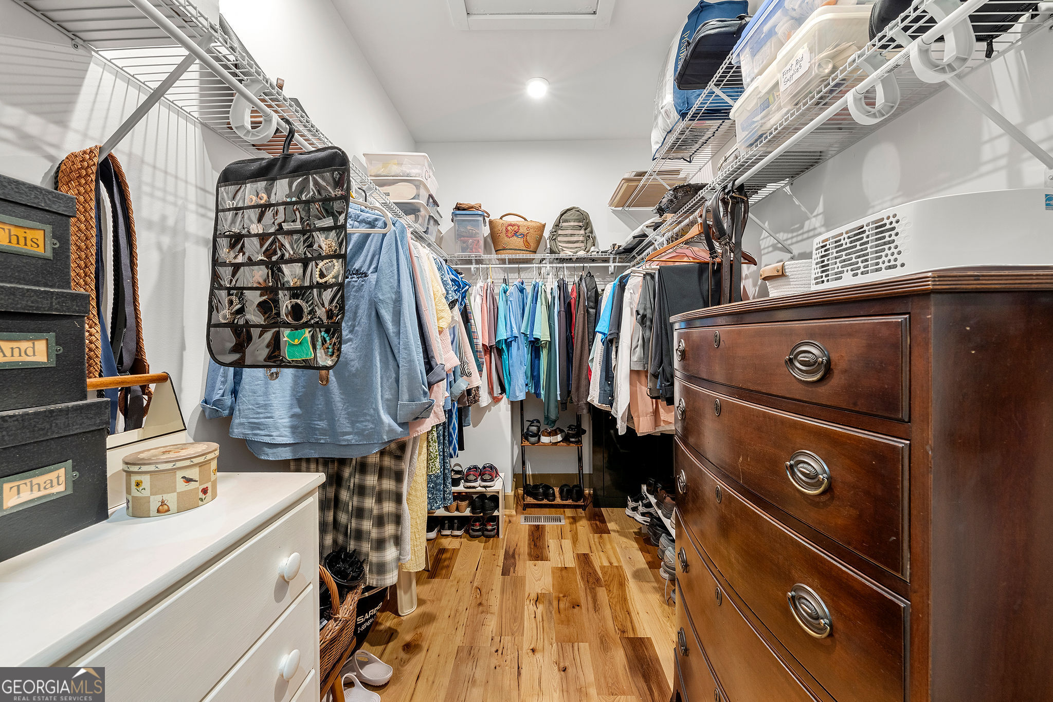 1638 Minor Road Culloden, GA 31016 - Photo 66 of 144 a view of walk in closet with clothes and shoes