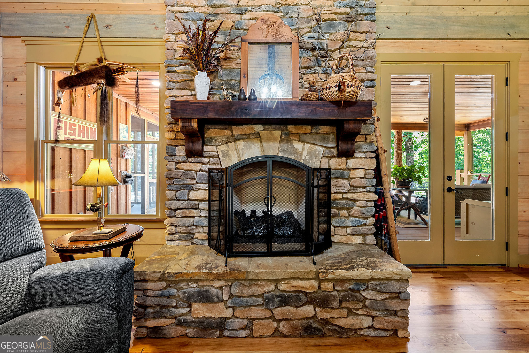 1638 Minor Road Culloden, GA 31016 - Photo 73 of 144 a living room with furniture a flat screen tv and a fireplace