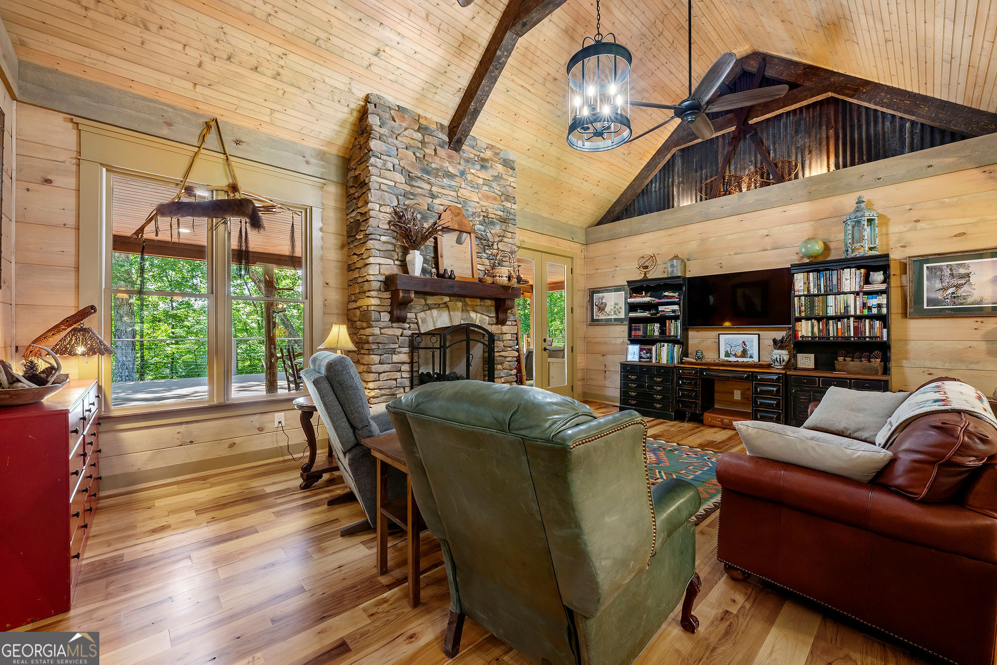 1638 Minor Road Culloden, GA 31016 - Photo 89 of 144 a living room with furniture a fireplace and a floor to ceiling window
