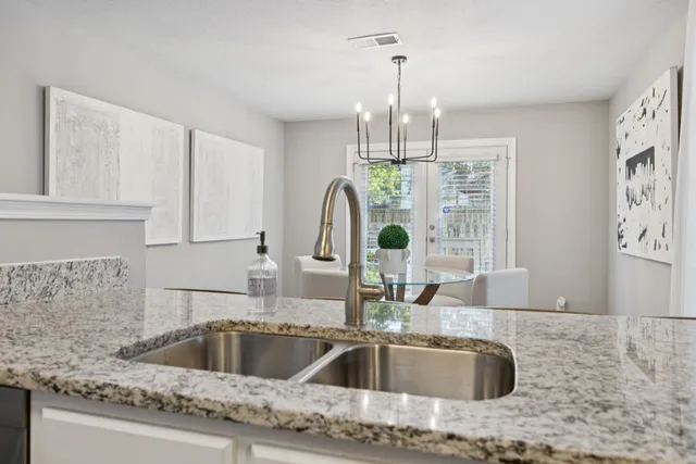 a view of a house with a yard and sitting area