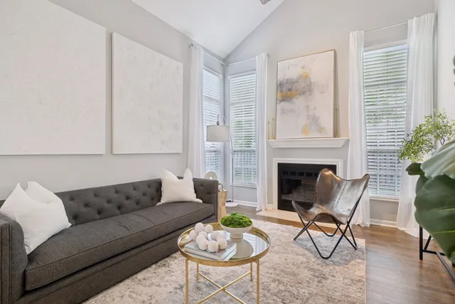 a kitchen with stainless steel appliances granite countertop a stove a sink dishwasher and a microwave with wooden floor