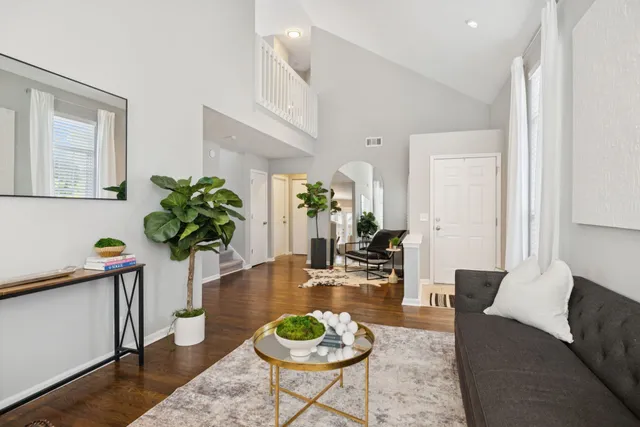 a kitchen with stainless steel appliances granite countertop a sink refrigerator and cabinets