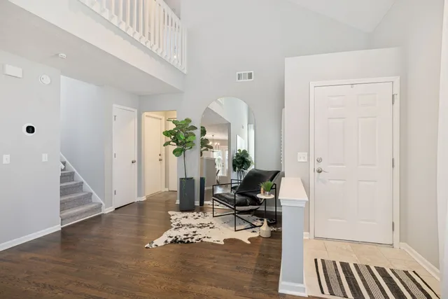a kitchen with granite countertop a sink stainless steel appliances and cabinets