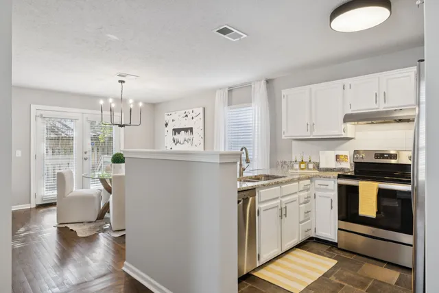 a bedroom with a large bed and a large window