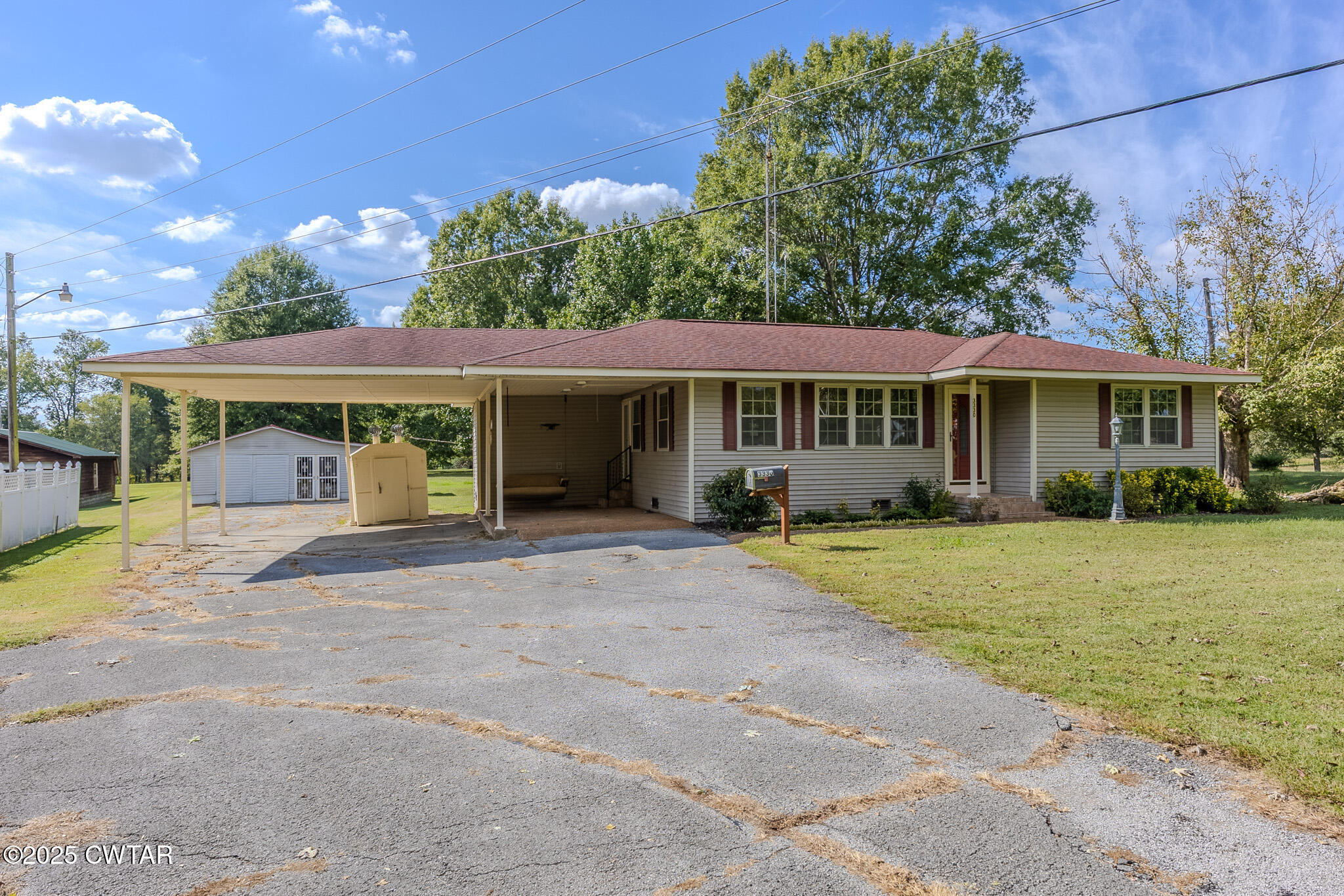 3330 Crucifer Road Huron, TN 38345 - Photo 1 of 15 a view of a house with a yard and potted plants