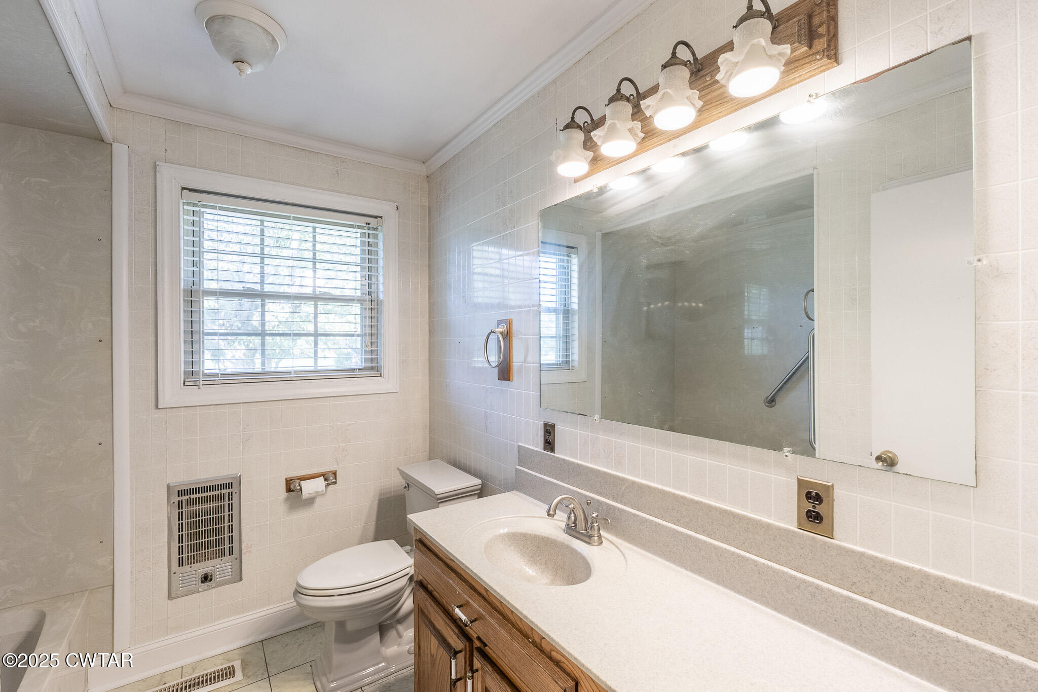 3330 Crucifer Road Huron, TN 38345 - Photo 11 of 15 a bathroom with a sink a toilet a mirror and shower