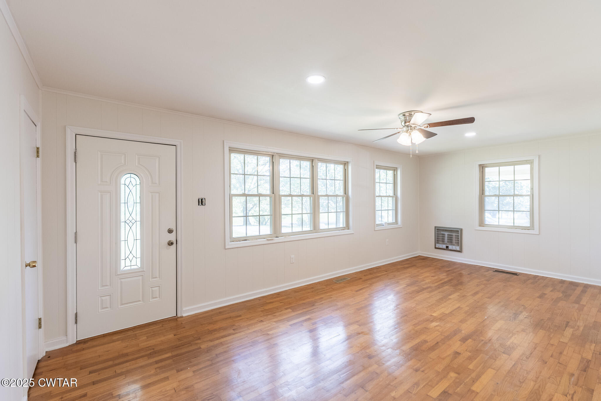 3330 Crucifer Road Huron, TN 38345 - Photo 4 of 15 a view of an empty room with wooden floor and a window