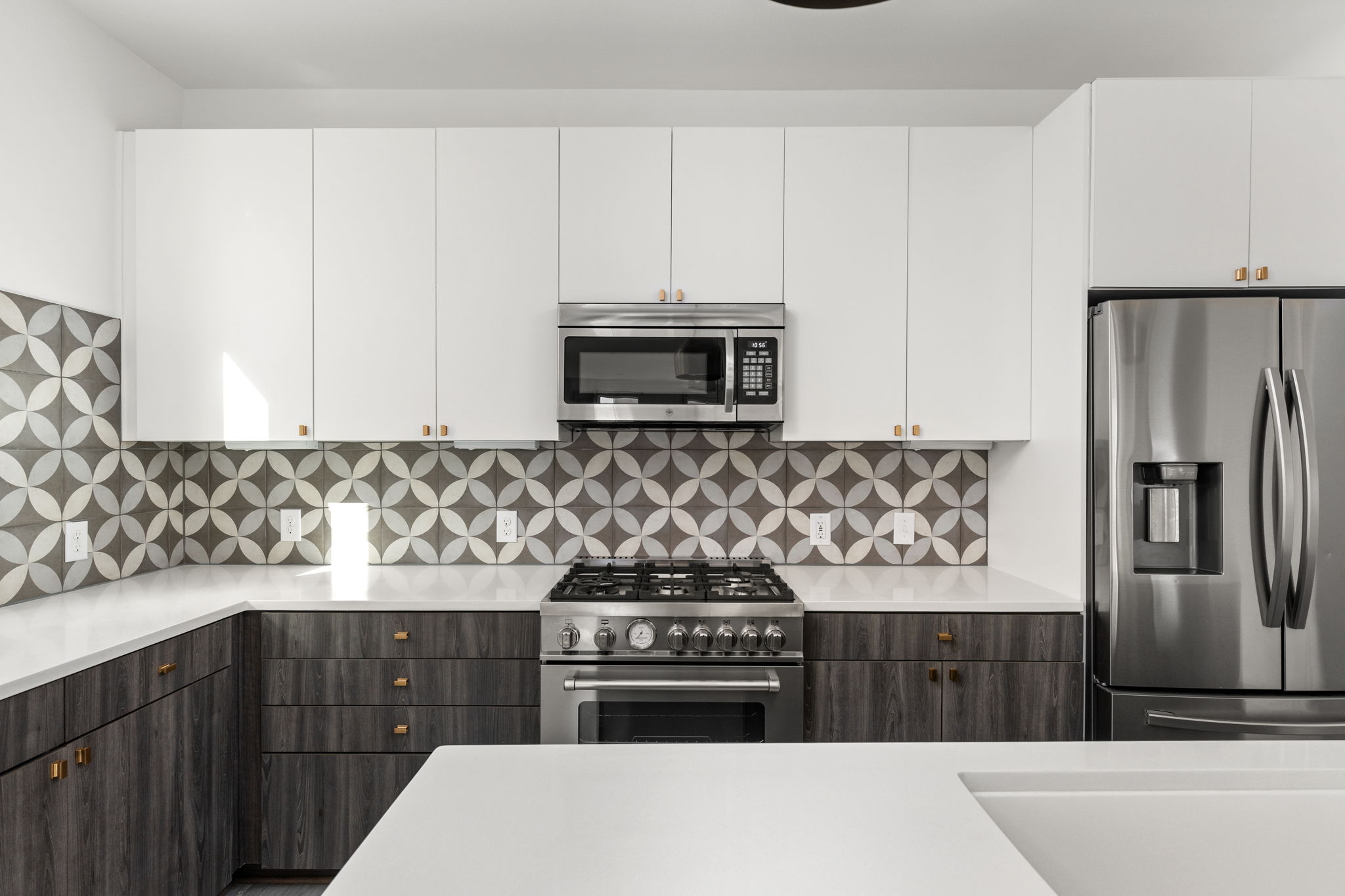 2624 Metcalfe Road, Unit 17 Austin, TX 78741 - Photo 8 of 35 a kitchen with stainless steel appliances wooden cabinets and a stove