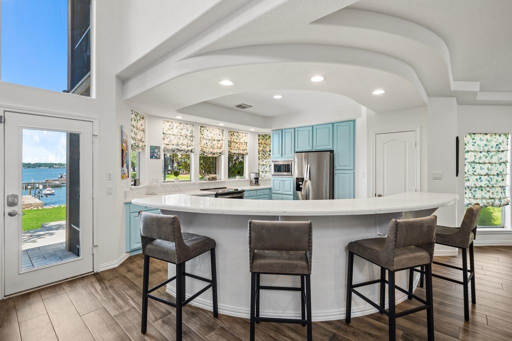 1607 Schooner Point Willis, TX 77318 - Photo 9 of 47 Imagine eating your meals at this large breakfast bar while enjoying the lakeview!