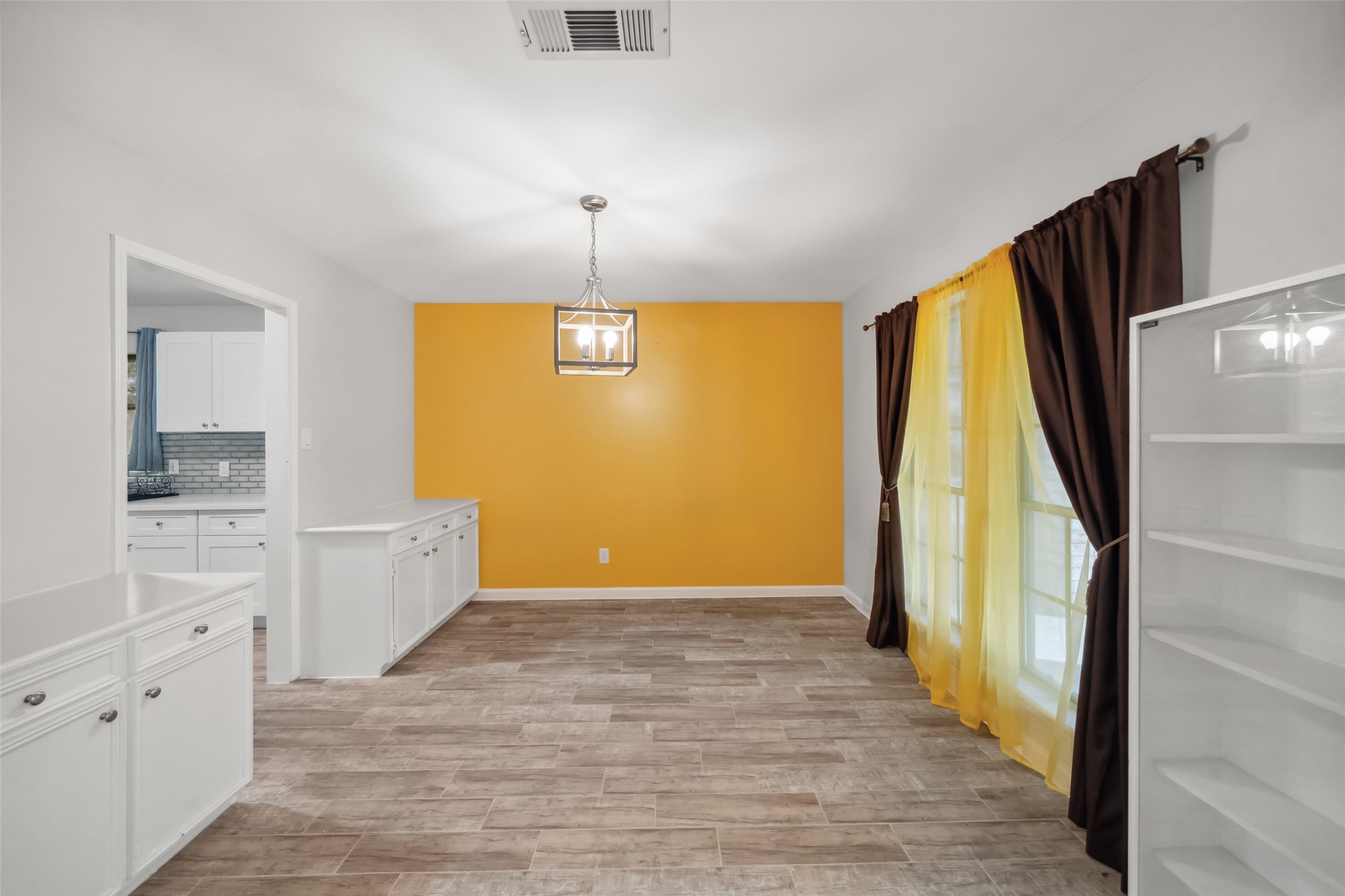 202 Black Forest Drive Spring, TX 77388 - Photo 7 of 26 FORMAL DINING ROOM WITH BUILT-INS WHICH FLOWS NATURALLY OFF THE UPGRADED KITCHEN. NATURAL LIGHT FROM OUTSIDE THE HOME