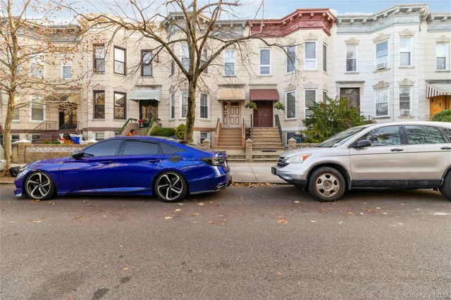a view of a cars parked in front of a building