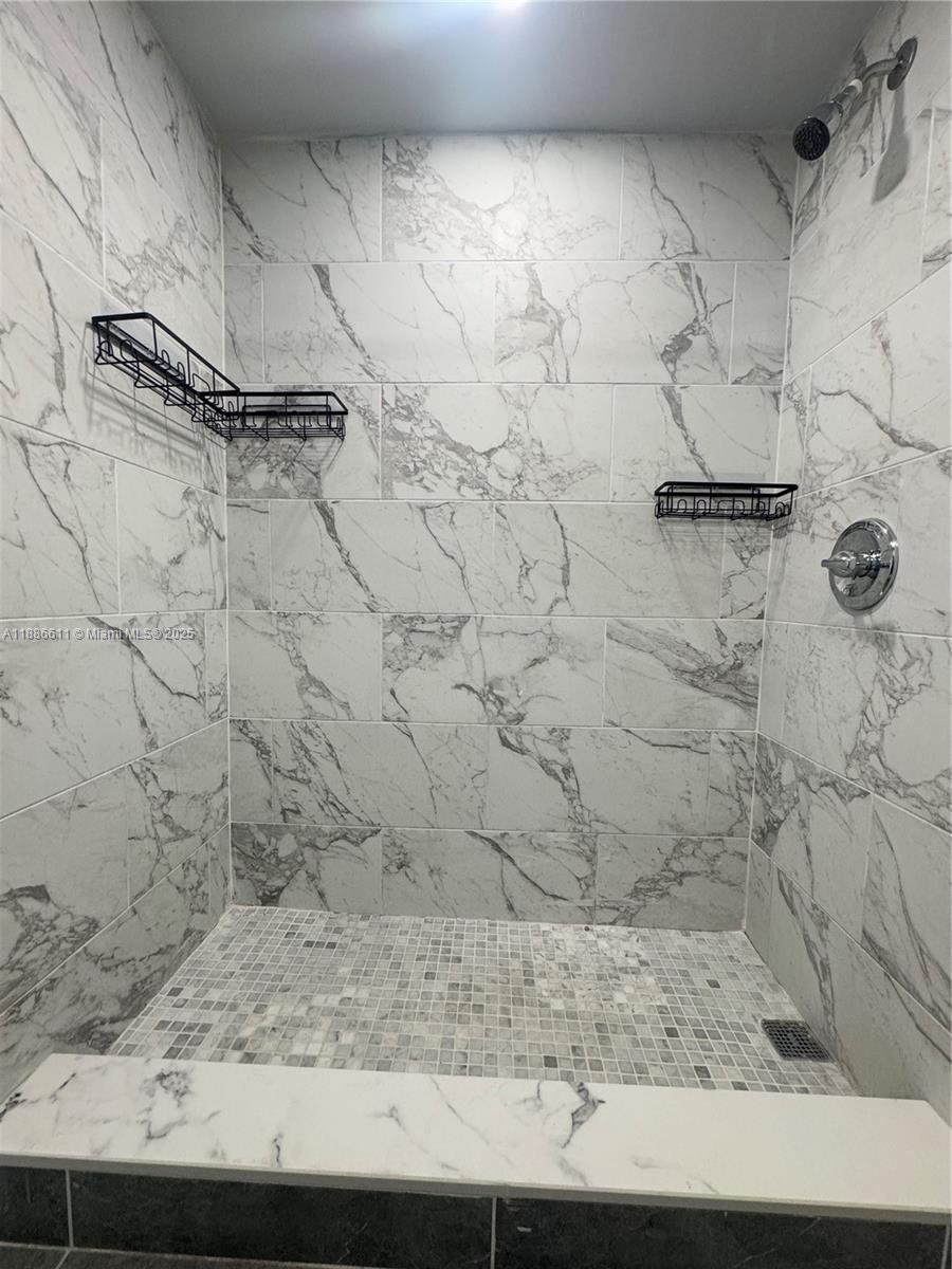 9220 Fontainebleau Boulevard, Unit 507 Miami, FL 33172 - Photo 8 of 9 a bathroom with a shower