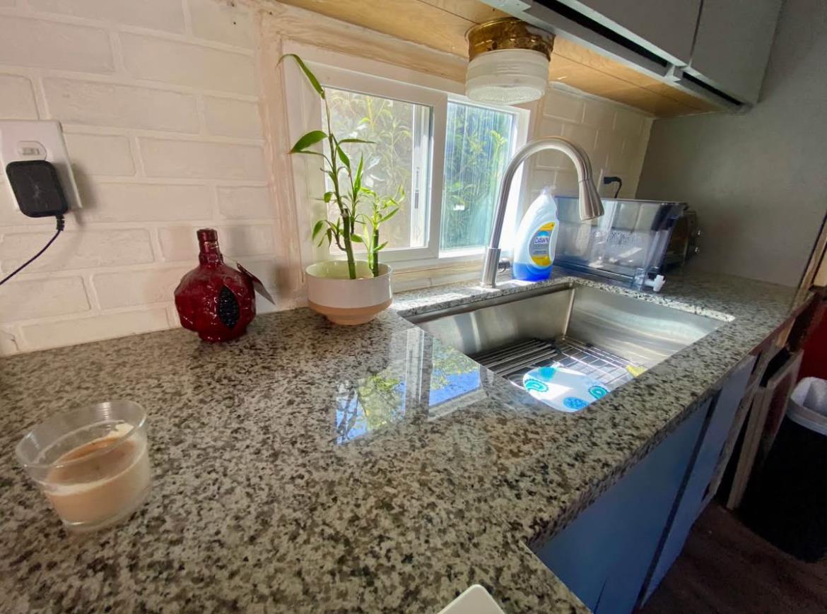 3632 9th Street Ceres, CA 95307 - Photo 7 of 23 a kitchen with a sink a counter and cabinets