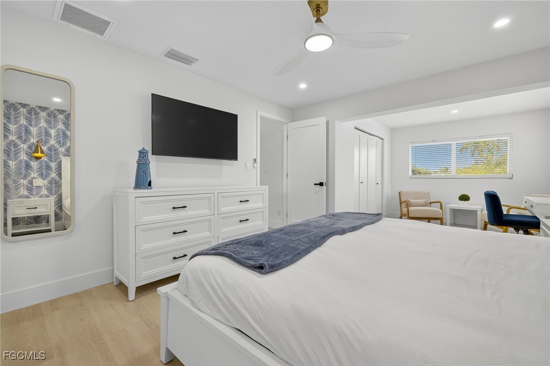1377 Sand Castle Road Sanibel, FL 33957 - Photo 18 of 49 a bedroom with a bed and a flat screen tv