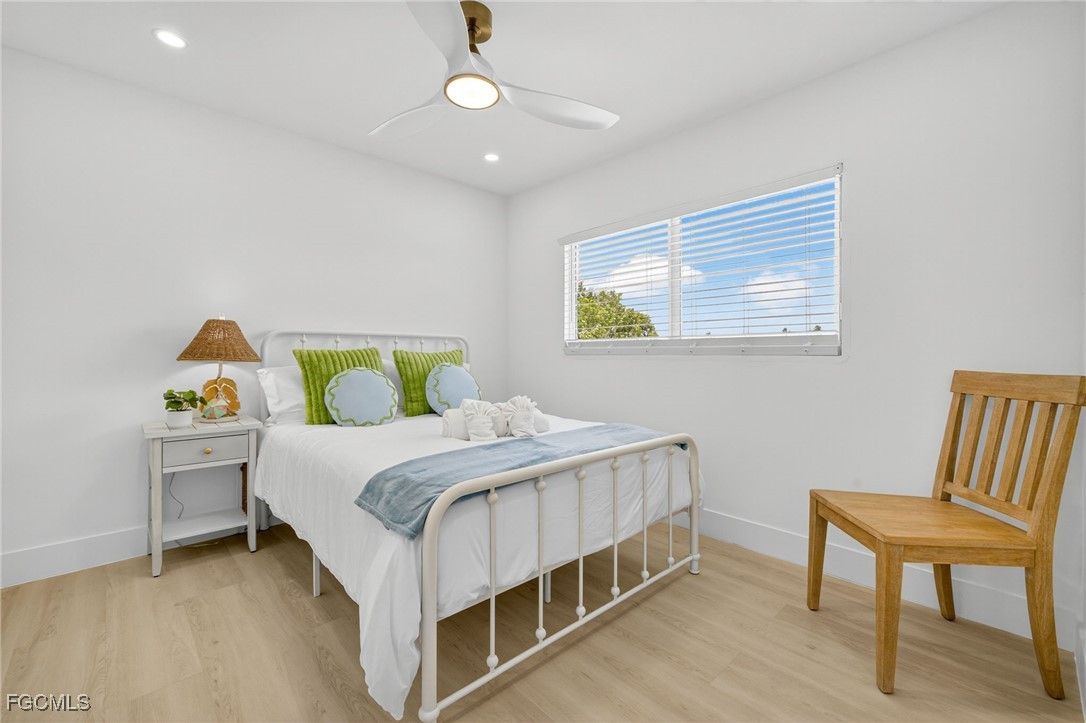 1377 Sand Castle Road Sanibel, FL 33957 - Photo 23 of 49 a bedroom with a bed and a table