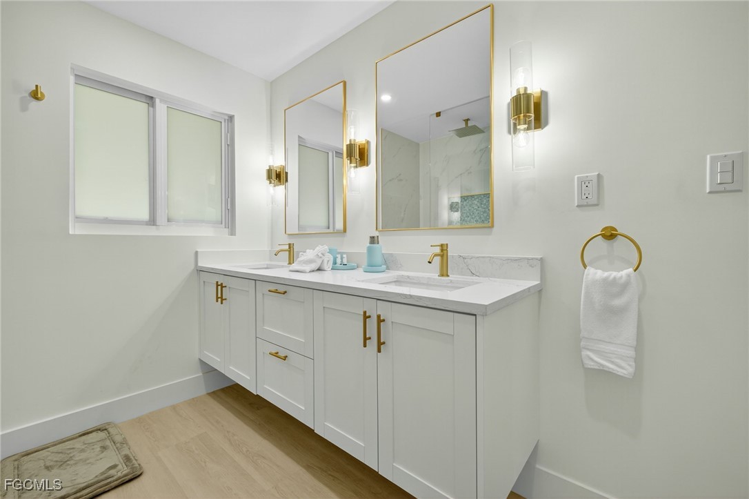 1377 Sand Castle Road Sanibel, FL 33957 - Photo 27 of 49 a bathroom with a sink and a mirror