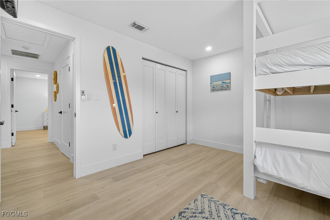 1377 Sand Castle Road Sanibel, FL 33957 - Photo 31 of 49 a view of a room with wooden floor and windows