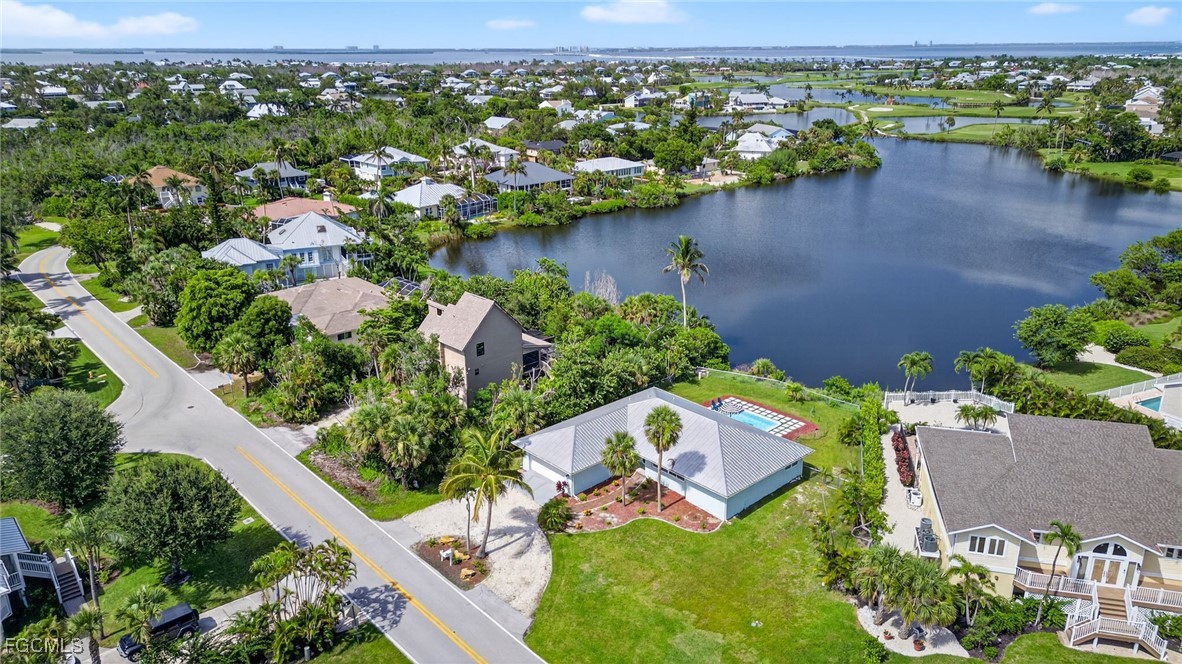 1377 Sand Castle Road Sanibel, FL 33957 - Photo 49 of 49 an aerial view of a house with a lake view